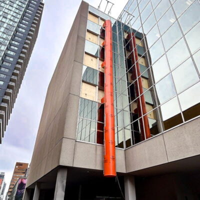 Orange Superchute installed on a building.